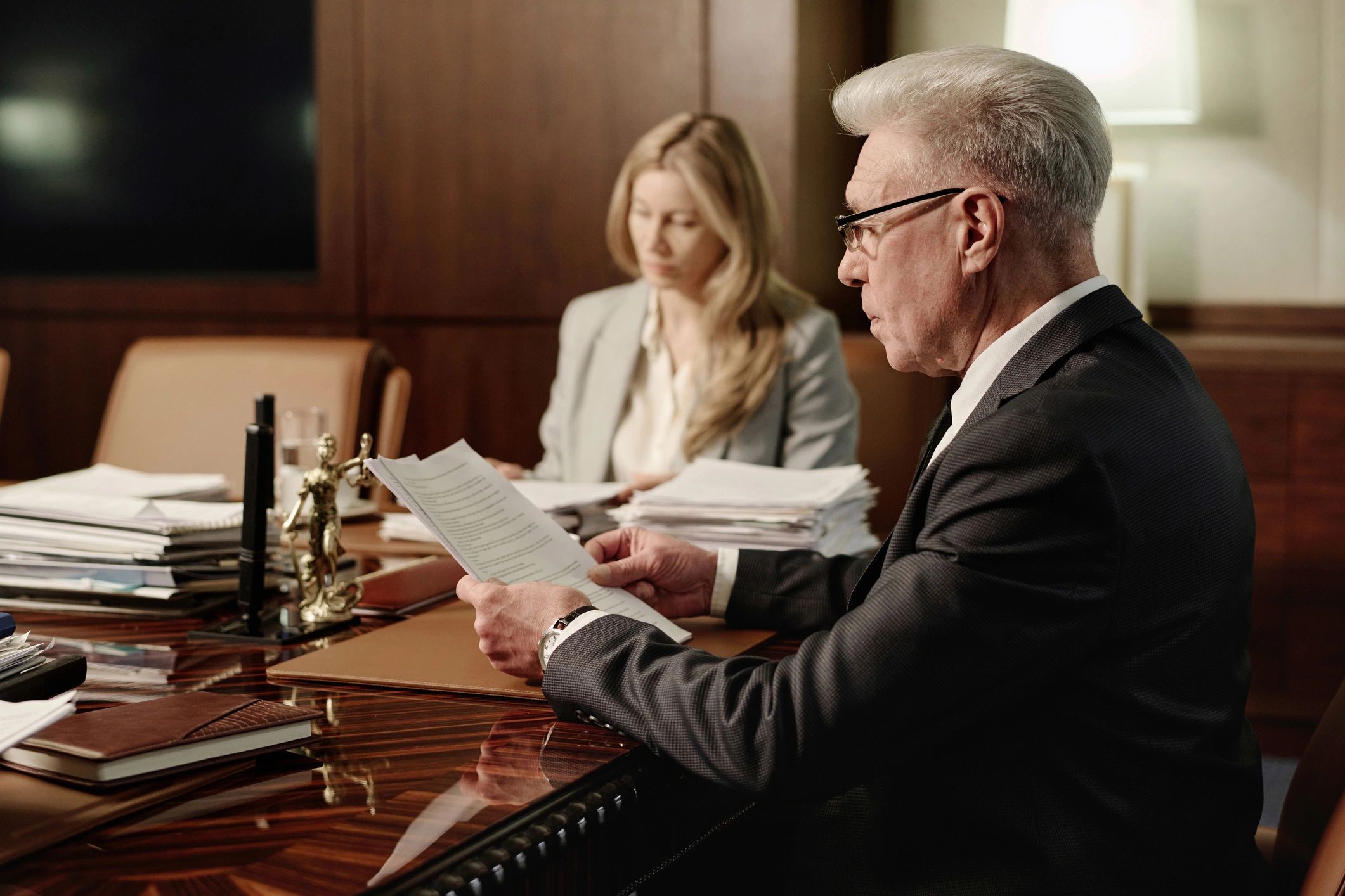 Attorney reviewing a contract in a meeting room